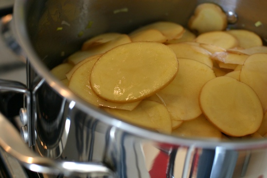 Add the sliced potatoes