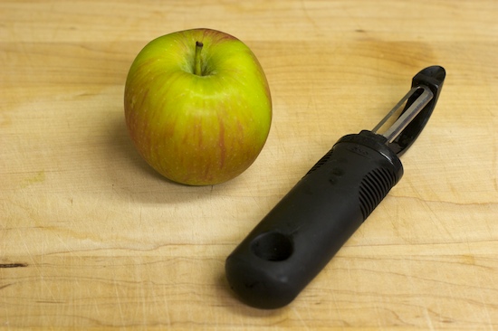 First peel the apple using a paring knife or vegetable peeler. I prefer the latter.