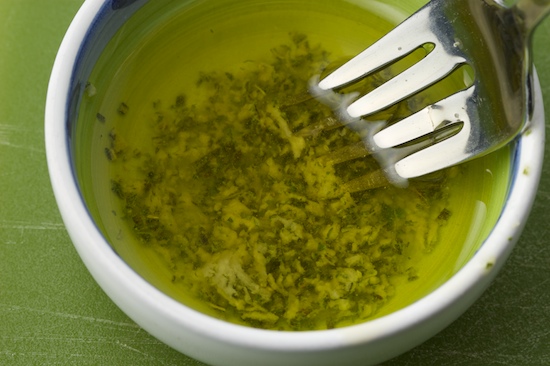In a small bowl, mix the rosemary garlic paste with the olive oil.