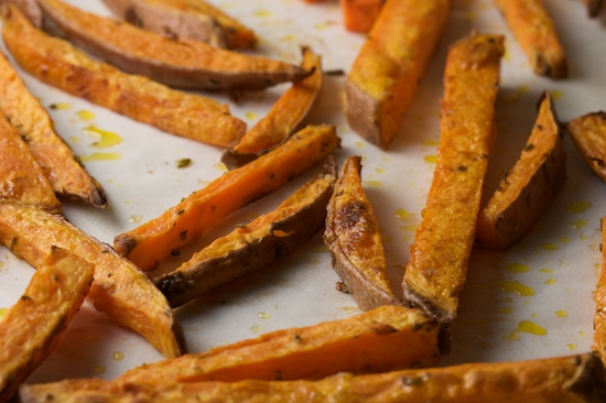 Roast the sweet potato fries in a 425 degree oven for 30-35 minutes, or until golden brown. Check them every ten minutes, and stir or turn them if they appear to be getting dark on the bottom. Watch carefully towards the end because they can burn quickly!