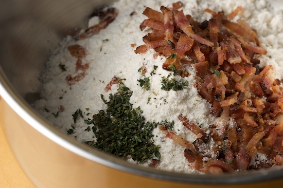 In a medium bowl, combine baking mix, chopped bacon, and chopped fresh thyme.
