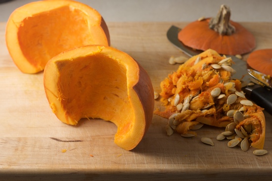 Cut the pumpkin in half and scrape out the insides. Save the seeds for roasting if you're into that kind of thing!