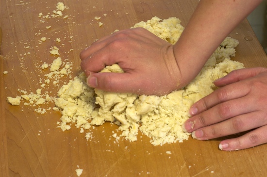 The dough will be crumbly but just work it together by hand until it's somewhat smooth.