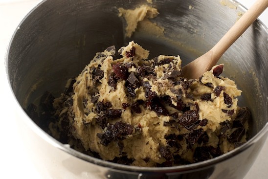     Now put down your mixer (don't forget to lick the beaters) and stir in the chocolate and cherries by hand.