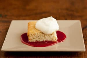 Coconut Bar with Cherry Sauce and Whipped Cream