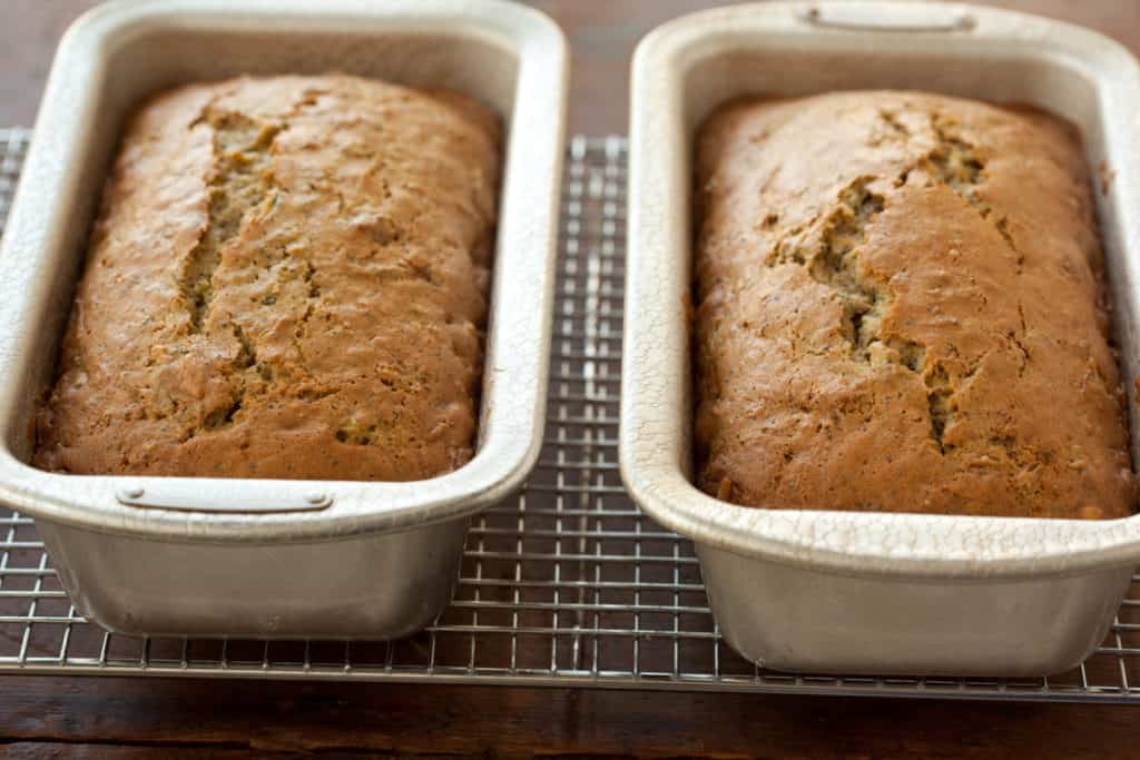 Lemon poppy seed zucchini bread in loaf pans on cooling rack